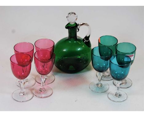 A small collection of miscellaneous glassware, to include green glass decanter and stopper, a set of four cranberry glass liq