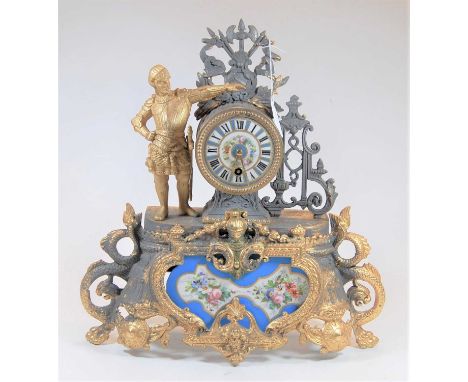A Louis XV style gilt metal and porcelain inset mantel clock, the case adorned with a lone soldier, eight day French brass cy