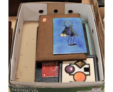 A modern wall plaque enamel decorated with a school girl, 23x13cm, together with two other enamelled wall plaques and one oth