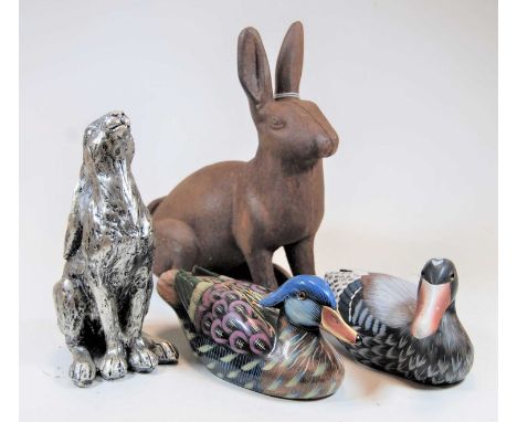 One painted composition decoy duck, one other ceramic example, silvered composition model of a recumbent hare, and one other 
