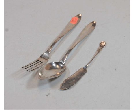 A late 19th century continental white metal table fork; together with a matching tablespoons, and an English silver butter kn