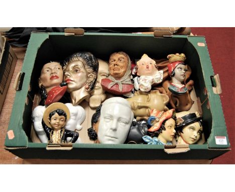 A large collection of assorted wall masks to include ceramic and painted wooden examples