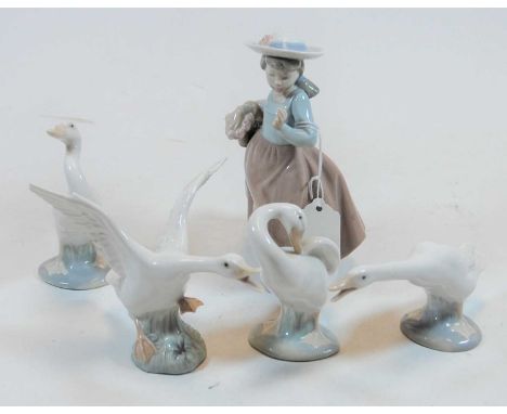 A Nao Spanish porcelain figure of a girl, wearing a hat and with basket in hand; together with four various Lladro figures of