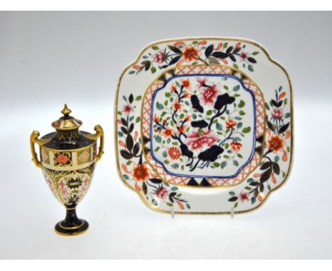 A Royal Crown Derby twin handle urn and cover decorated in the Imari palette, pattern 1128, date cypher 1911, 15.5 cm high, t