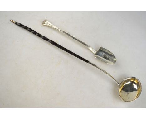 A late Victorian stilton scoop with feather-edge and scroll handle, London 1896, 2.4 oz, to/w a George III punch ladle with o