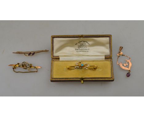 A yellow metal safety pin style brooch set with pearl set bow with turquoise centre, in case supplied by Spink and Son to/w t