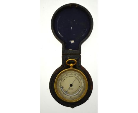A 19th century gilt metal pocket barometer by Martin & Co. of Cheltenham, the engraved and silvered dial set with small curve