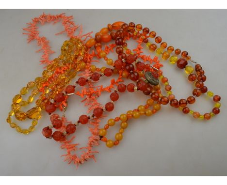 A large collection of vintage necklaces including two rows of stick coral, glass and ceramic beads etc