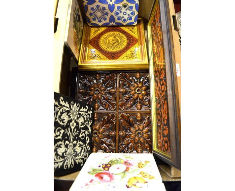 Victorian tiles comprising; a framed set of four brown glazed tiles decorated in relief with acorns and oak leaves to/w a thr