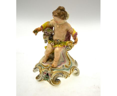 An early Derby figure of a putto seated on a rococo style bench draped with material and floral garlands, impressed N323 to b