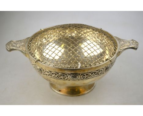 A heavy quality Scottish silver rose-bowl in the form of an oversize quaich with twin handles and Celtic strapwork decoration