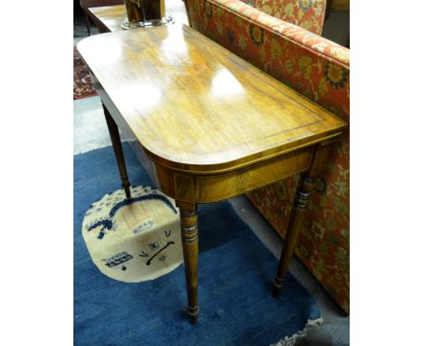 A Victorian rosewood cross-banded mahogany fold-over card table, raised on a turned double gate-leg frame