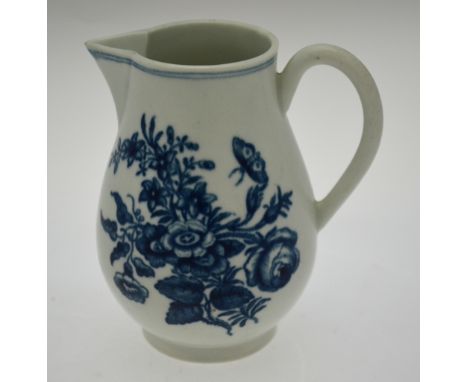 An 18th century Worcester porcelain blue and white sparrow beak jug decorated with a spray of flowers, sprigs and butterflies