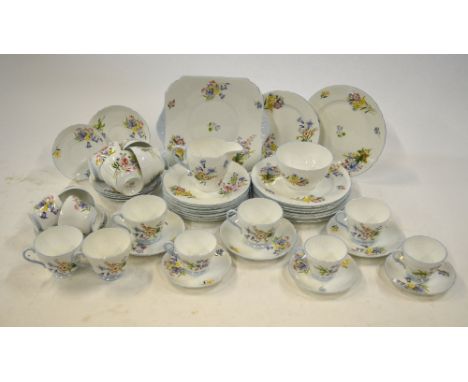 A Shelley 'Wild Flowers' tea and coffee service comprising: nine 20.5 cm plates; nine 18 cm plates; one square cake plate; ni