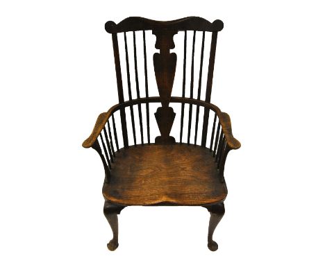 A George III elm seat Windsor armchair, Thames Valley circa 1800, the comb crest over a vase-shaped vertical splat, raised on