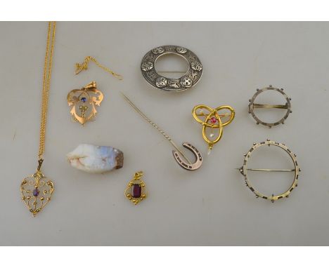 A collection of various silver and gold jewellery items including garnet set pendant, amethyst and pearl set pendant, sapphir