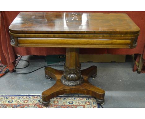 An early Victorian cross-banded figured mahogany tea table, the fold over top raised on a multi-facetted support with moulded