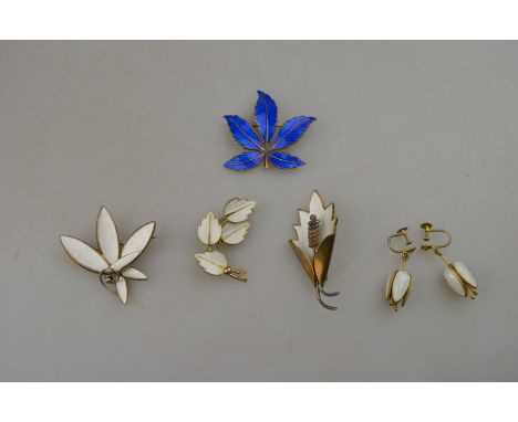 A collection of white enamelled Norwegian silver gilt jewellery including three leaf brooches and pair of fuschia drop screw-