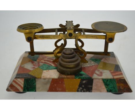 An unusual set of Victorian brass postage scales on specimen marble base, 19 cm wide
