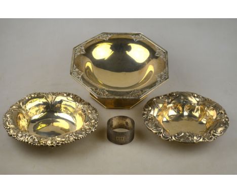 An octagonal silver comport with pierced corners, Walker & Hall, Birmingham 1919 and two US Sterling embossed dishes by J. E.