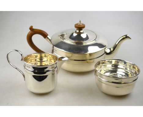 A three-piece silver tea service of circular form, Joseph Rodgers & Sons Ltd., Sheffield 1931, 19.5 oz gross