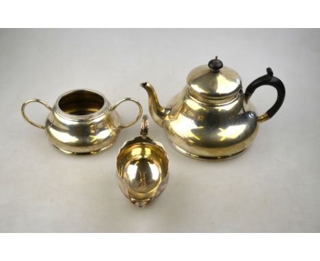 An Edwardian silver teapot and matching sugar basin of compressed pear-shape form, A & J Zimmerman, Birmingham 1907, 15.9 oz 