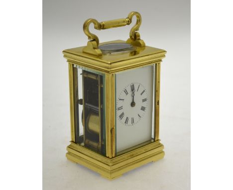 A French lacquered brass two cylinder 8-day carriage clock with folding handle striking the half hours and hours on a spiral 