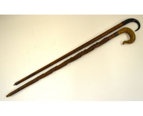 A Swiss walking stick with chamois horn handle, to/w another walking stick with crook-style hook handle and twist-carved body
