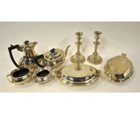 A four-piece electroplated half-reeded tea/coffee service, to/w a pair of Victorian baluster candlesticks and two entree dish