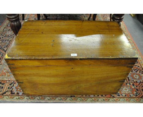 A Victorian brass-bound camphorwood campaign trunk by Army & Navy, the hinged top enclosing an unfitted interior with ivorine
