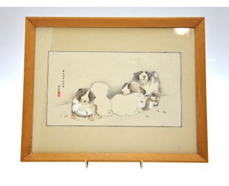 After Maruyama Okyo - a wood block print of a group of puppies in a snowy landscape, signed and with red seal for Okyo, 13.5 