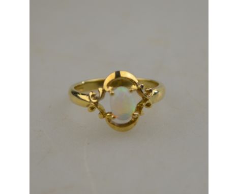 A single stone opal ring, 9ct yellow gold set