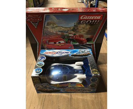 A HOVER XTREME HOVER CRAFT AND A LIGHTENING MCQUEEN SCALEXTRIC