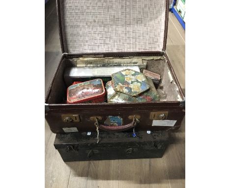 A VINTAGE SUITCASE AND CONTENTS AND METAL CASE