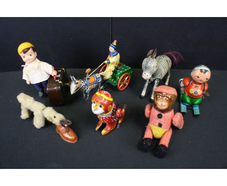 Seven vintage tin plate toys to include wind up Skiier (China), clockwork Marching Money, wind up plastic figure with tin pla