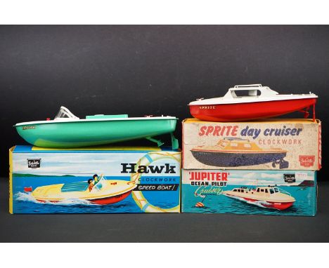 Three boxed Sutcliffe clockwork metal boats to include Jupiter Ocean Pilot Cruiser in red &amp; white, Sprite Day Cruiser in 