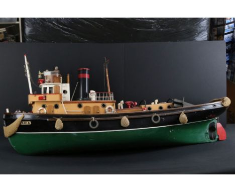 Large well built tug boat made for engine fittings (none present), shows some wear and display dust but gd overall, with figu