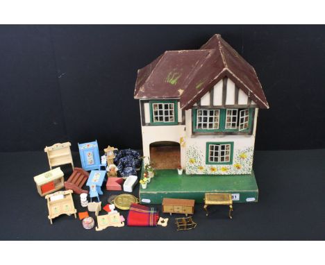 Mid 20th C Triang painted wooden dolls house, Triang mark to reverse, 42cm high, together with a quantity of wooden and plast