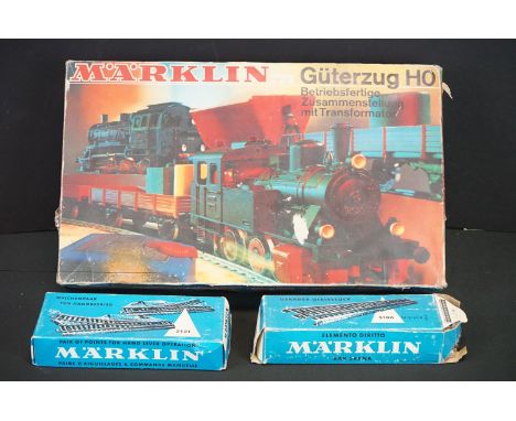 Boxed Marklin HO gauge 2969 train set containing 0-6-0 DB locomotive, 2 x items of rolling stock, track, controller and paper