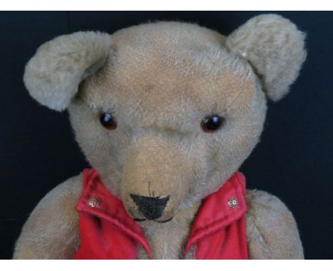 Chad Valley jointed straw filled teddy bear with label to foot, red waistcoat, showing some wear and hair loss, approx 2ft he