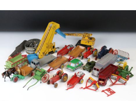 Around 20 play worn mid 20th C diecast models to include Dinky and Britains, mainly featuring farming related examples, plus 