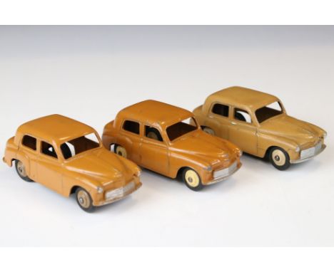 Three original Dinky Hillman Minx diecats model variants to include 2 x 1st casting 40f examples in butterscotch with name to