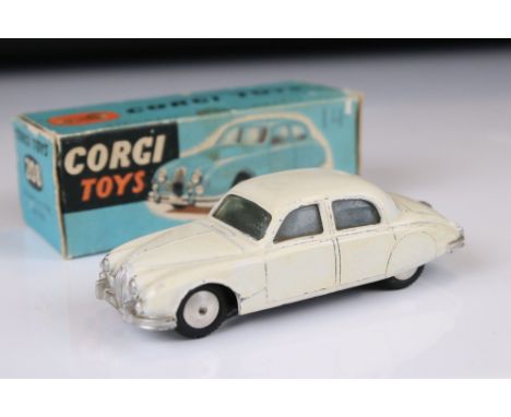 Boxed Corgi 208 Jaguar 2.4 Litre Saloon diecast model in white, showing some discolouring and paint chips to diecast, fair bo