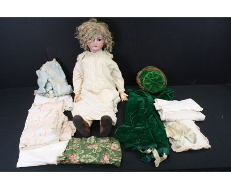 A Kammer &amp; Reinhardt, Simon &amp; Halbig bisque head doll with sleeping brown eyes, composition body dressed with socks a