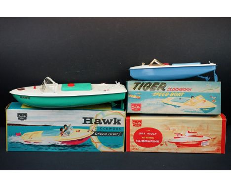 Three boxed Sutcliffe clockwork metal boats to include Hawk in light green &amp; white, Tiger Speed Boat in light blue &amp; 
