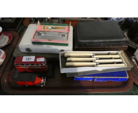 A Tray Containing Cased Cutlery, Bone Handled Knives, Cased Harp by Hohner, Two Diecast Toys