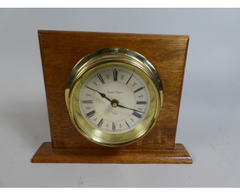 A Nice Quality Circular Brass Clock Mounted on Oak Stand, Battery Movement, 21cm high 