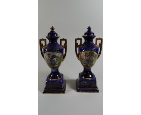 Two Continental Cobalt Blue and Gilt Two Handled Vases, One with Finial (AF)
