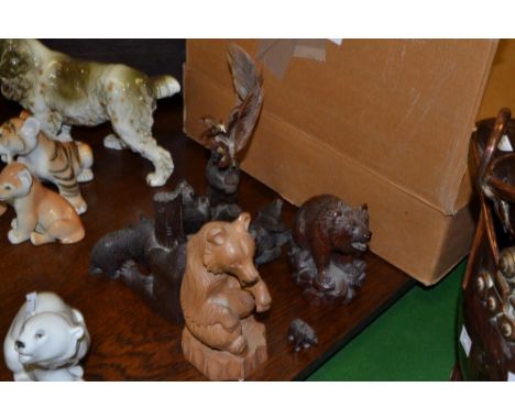 A carved wooden Black Forest bear desk thermometer, others pen stand, bottle topper, spill holder etc (9)