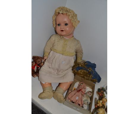 A mid 20th century composite doll; an early 20th century jointed doll, open blue eyes; a Hummel bear ; etc 